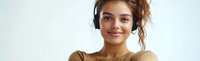 Young woman with headphones enjoying music streaming service with peaceful expression on white background isolated for design projects.