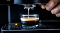 Fresh espresso pouring from coffee machine into glass cup, creating rich crema layer with golden streams against dark background.