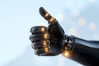 Glowing robotic hand with illuminated joints against blurred light background, showcasing advanced technology and artificial intelligence in modern robotics.