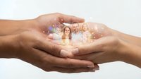 Protective cupped hands holding glowing family figures with sparkles, symbolizing care, security and love for family members on white background.