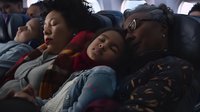 Tired passengers sleeping during long distance travel on airplane or bus, perfect for articles about transportation, travel fatigue, or public transit comfort.