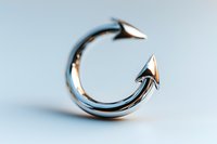 Sleek silver arrow ring with open design on light blue background, modern minimalist jewelry piece for fashion and accessory concepts.