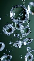 Macro photography of water bubbles suspended in air against dark green background, showcasing liquid surface tension and light refraction properties.