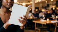 Woman holding blank white card at corporate event with warm lighting and blurred colleagues in background, suitable for business presentations and marketing materials.