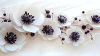 Elegant white paper flowers with dark purple centers and berries arranged on neutral background for wedding decor, crafting projects and floral designs.