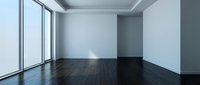 Empty modern room with dark hardwood floors, white walls and large windows creating bright minimalist interior space for design projects.