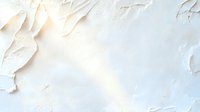 Textured white plaster wall with rough uneven surface and soft shadows creating abstract artistic background with copy space for modern interior design.