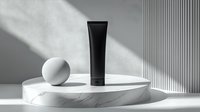 Minimalist cosmetic black tube on marble podium with white sphere, dramatic shadow play and sunlight. Clean luxury skincare product presentation.