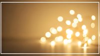 Warm golden bokeh lights creating soft glowing circles on blurred background for festive decoration and ambient lighting design projects.
