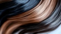 Flowing wavy hair strands in dark brown and caramel highlights creating smooth texture waves for beauty salon and haircare product advertisements.