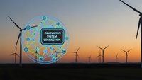 Wind turbines at sunset with digital innovation system connection network overlay for renewable energy technology and smart grid solutions.