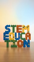 Colorful building blocks spelling STEM EDUCATION with science symbols and gears, promoting learning in science, technology, engineering and mathematics.