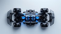 Futuristic racing vehicle concept with glowing blue elements and exposed mechanical parts viewed from above on dark background, featuring aerodynamic design and hover wheels.