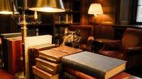 Cozy tabby cat resting among stacked books in warm library setting with vintage brass lamp and leather furniture creating scholarly atmosphere for reading.