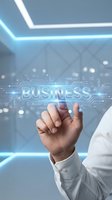 Businessman touching digital business interface with circuit board design in modern office environment for corporate technology presentations.
