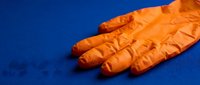 Fresh ginger root with wrinkled skin isolated on vibrant blue background, suitable for food, cooking, and wellness design projects.