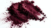 Crushed burgundy powder pigment scattered on white background, isolated for cosmetic, makeup, art and design projects.