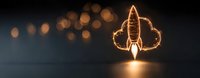 Glowing rocket light painting with bokeh effect against dark background creates magical atmosphere for space and technology concepts. Illuminated spacecraft launch.