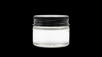 Small clear glass jar with black screw lid, isolated on transparent background. Ready for cosmetic, canteen, or product packaging clipart, stickers, and print on demand use.