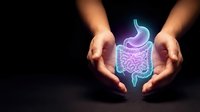 Hands holding a glowing holographic digestive system with stomach and intestines on dark background, symbolizing gut health and gastroenterology.