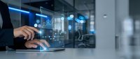 Businessman analyzing financial data on laptop with holographic charts and graphs in modern office environment for business analytics and reporting.