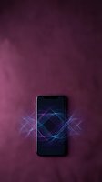 Smartphone displaying glowing neon geometric patterns with blue and purple light waves on dark screen against textured burgundy background. Suitable for technology, innovation, digital communication.