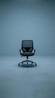 Modern black office chair with mesh back and padded seat on wheeled base, isolated against blue background for corporate workspace design and furniture marketing.