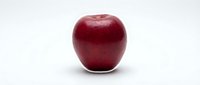 Fresh red apple isolated on white background, ready for food and nutrition design projects.