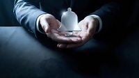 Businessman hands protecting white light bulb symbolizing innovation, creativity and bright ideas for business solutions and entrepreneurship concepts.