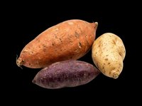 Isolated root vegetables including orange sweet potato, purple yam, and tan potato on transparent background. Ready for clipart, print-on-demand, t-shirt design, stickers, and sublimation projects.