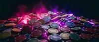 Colorful casino poker chips pile with dramatic purple and pink lighting effects on dark background for gambling and entertainment concepts.
