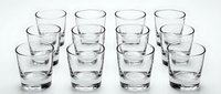 Set of twelve empty clear glass tumblers arranged in rows on white background, perfect for beverage service, restaurant supplies, and kitchen essentials.