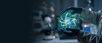 Scientist in laboratory holding glowing atom hologram symbol, representing nuclear physics, molecular research, and scientific innovation in modern technology environment.