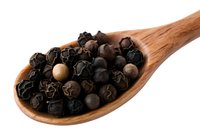Whole black peppercorns in wooden spoon on white background, aromatic spice and seasoning ingredient for cooking and food preparation.