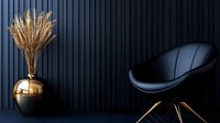 Modern dark blue interior with black leather chair and golden pampas grass vase against fluted wall panel for luxury home decor and contemporary design.