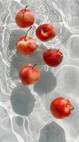 Fresh red apples floating in clear rippling water with water drops on fruit surface, creating dynamic shadows and light reflections. For food and wellness concepts.