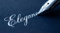 Fountain pen writing elegant cursive script on dark blue paper, showcasing calligraphy and formal penmanship for stationery, invitations, and professional correspondence.