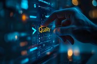 Hand touching glowing quality text on futuristic digital interface with blue technology elements and bokeh lights in dark background for business analytics.