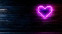 Glowing pink neon heart sign on dark wooden wall background creates romantic atmosphere, suitable for Valentine's day designs and love-themed projects.