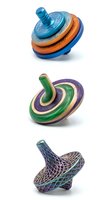 Colorful spinning tops with blue, orange, and green striped designs featuring geometric patterns, suitable for toy product photography and children's entertainment marketing.