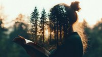 Young woman reading book at sunset in forest, silhouette against golden light filtering through pine trees, messy bun hairstyle, peaceful outdoor moment captured in warm tones.