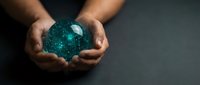 Two hands holding a glowing turquoise digital sphere with connected nodes and particles, representing technology, data networks, and global connectivity for business and innovation concepts.