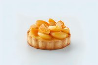 Fresh fruit tart with golden mandarin orange segments and sliced peaches arranged on sweet pastry crust against white background, isolated dessert.