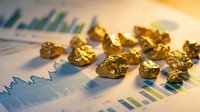 Gold nuggets scattered on financial charts and graphs showing market analysis data for precious metals commodity trading and investment portfolio planning.
