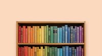 Colorful rainbow books arranged on wooden bookshelf against peach wall. Library organization, reading education, literature collection for home decor.