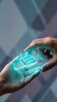 Hand holding glowing turquoise circuit board chip with digital pathways, representing technology innovation, artificial intelligence, and microprocessor development for tech industry applications.