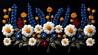 Embroidered floral border with white daisies, blue lupines and orange marigolds on black fabric background for textile design and craft projects.