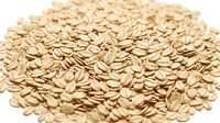 Rolled oats cereal grains isolated on white background, ready for food packaging, breakfast products, and nutritional content design.