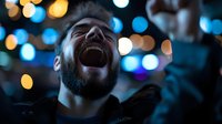 Bearded man laughing joyfully with colorful bokeh lights creating magical atmosphere in urban nighttime setting for lifestyle and happiness concepts.