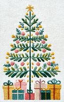 Embroidered Christmas tree with colorful ornaments and wrapped presents beneath on white linen fabric, showcasing festive needlework artistry.